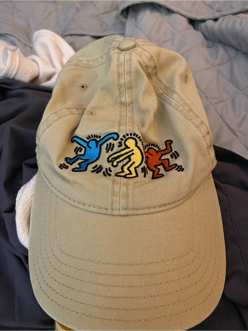 Mad Engine features embroidered Keith Haring dancing figures